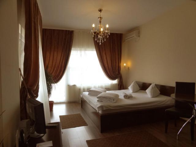 Ave Hotel Victoriei Bucareste Quarto foto